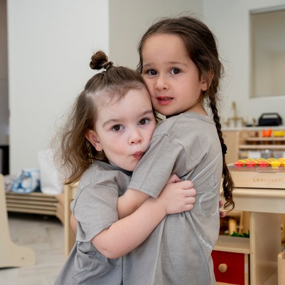 Two children sharing a hug